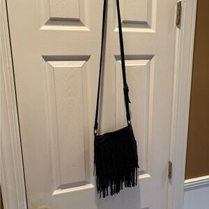 Fringe crossbody adjustable bag.
